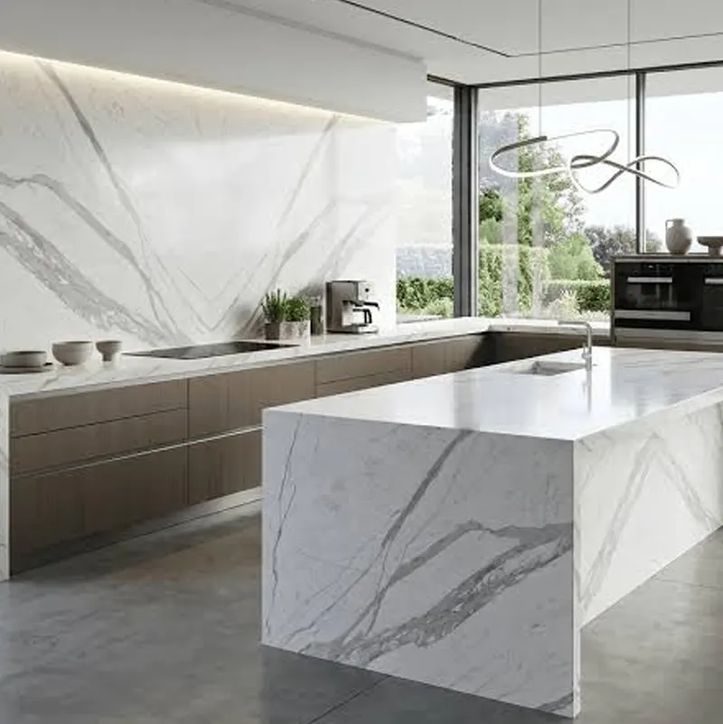 Statuario marble kitchen island with bold veining in a luxury home